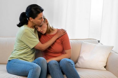 Woman receiving emotional support after ectopic pregnancy loss