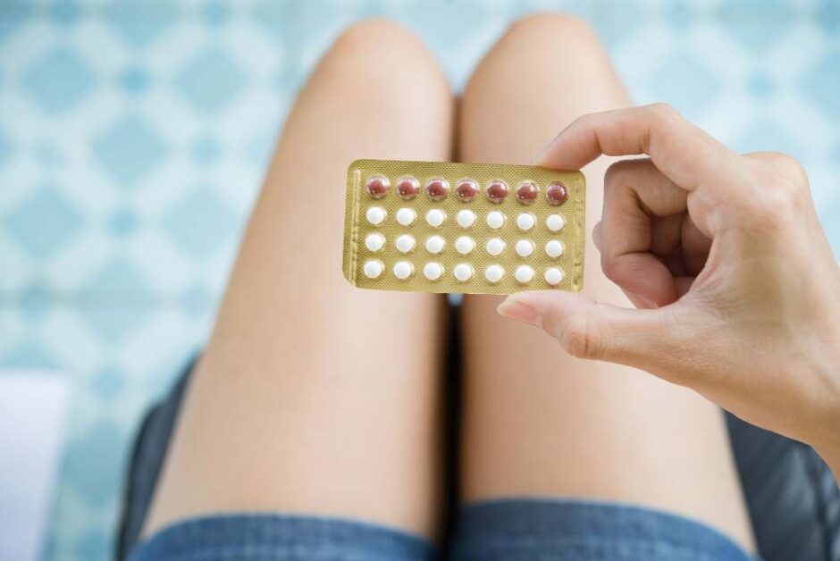 woman holding contraceptive pill blister pack