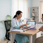 Doctor explaining legal abortion options to woman in clinic